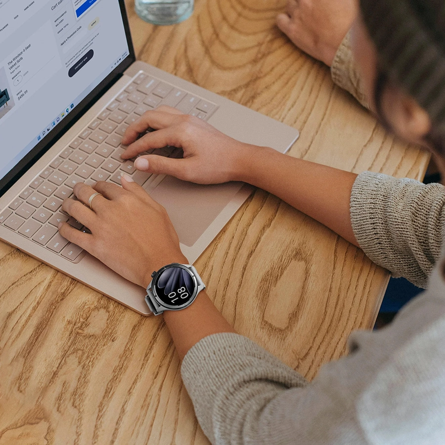 Woman wears Haylou Solar Neo while working on computer